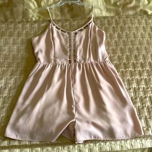 Tan/ beige spaghetti strap romper with pockets. Size large